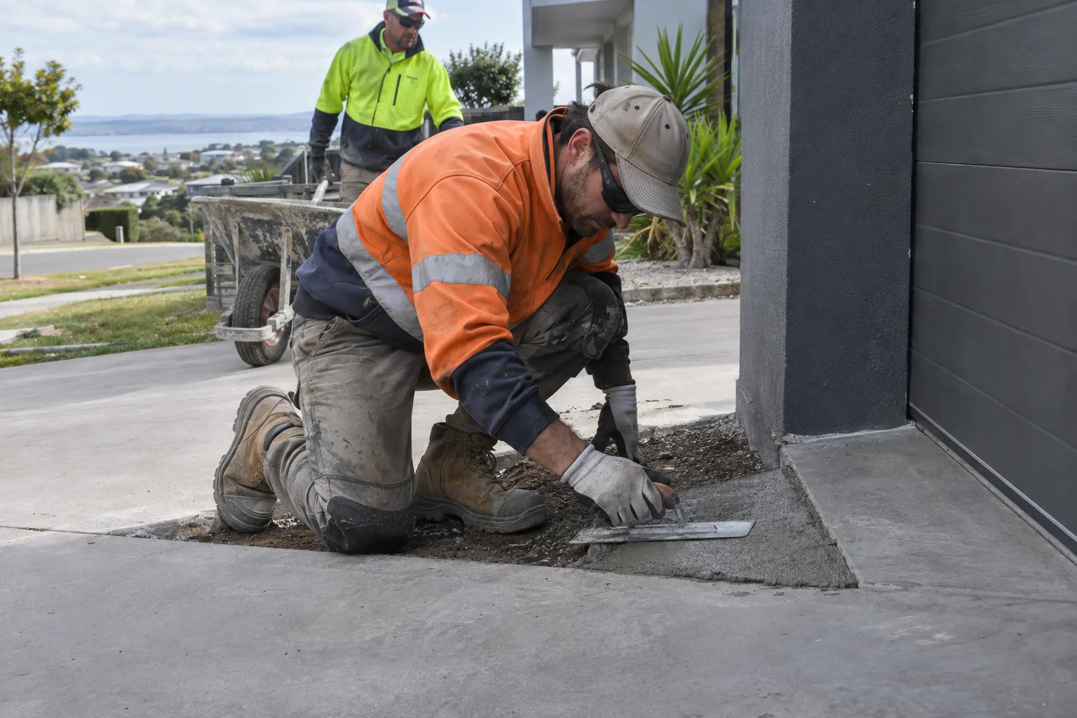 Tradespeople working on repairs in a Geelong-style residential setting