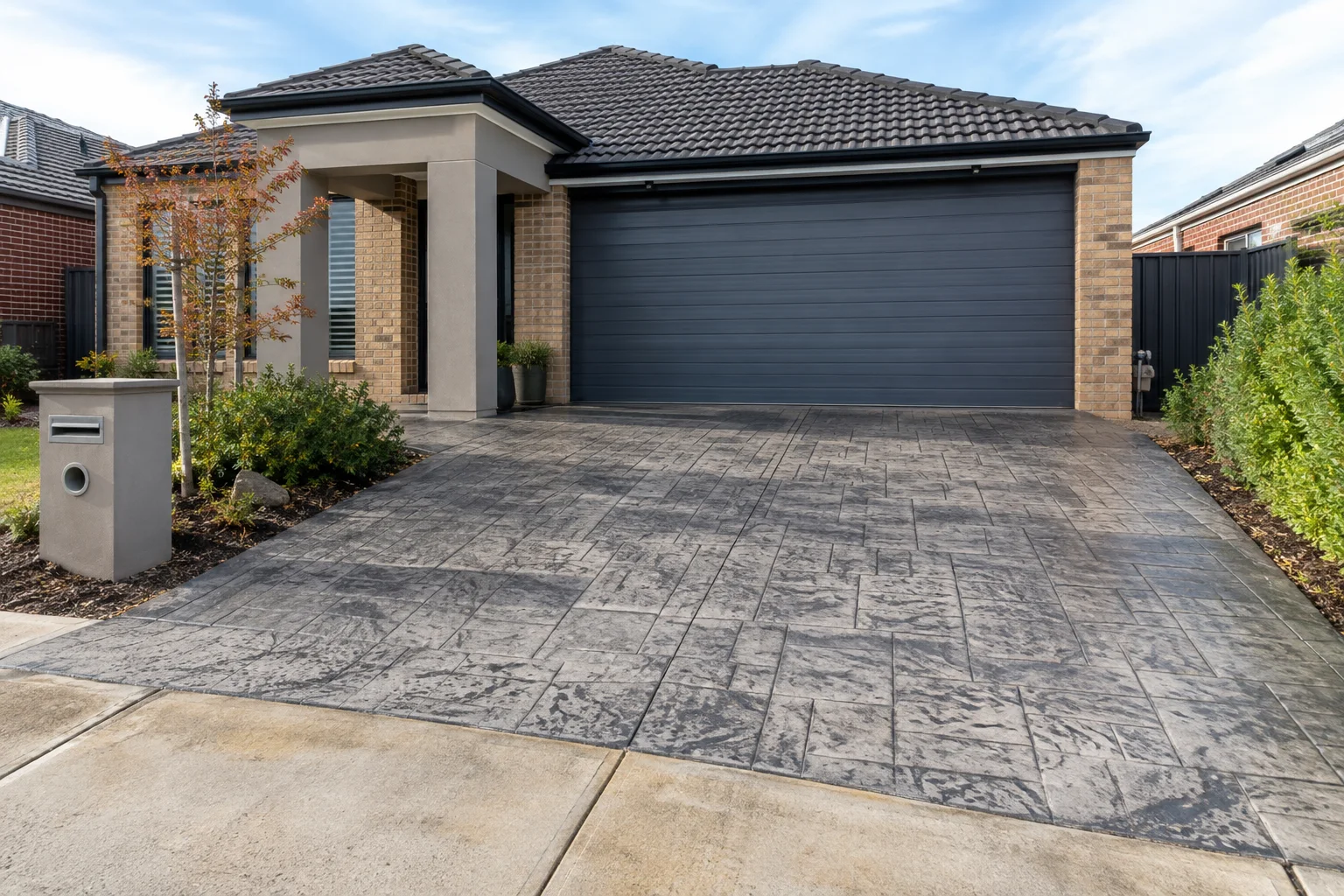 Finished stamped concrete driveways in a Geelong-style residential setting